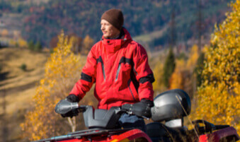 ATV rider admiring autumn scenery